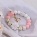 Silicone beaded keychain wristlet bracelet with cute daisy flower charm and heart gold clasp. - White & Pink Daisy