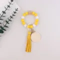 Silicone bead wristlet keychain with wooden accents, yellow leather tassel and round wood blank. - Bright yellow