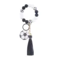 Silicone beaded wrist keychain with soccer pattern, leather tassel, and metal ring for women. - Football