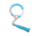 Silicone bead keychain detail shot showing smooth round beads and blue leather tassel clasp. - Dark Blue