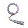 Silicone bead keychain with PU leather tassel and gold hardware detail for daily chic style. - Gray