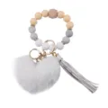 Portachiavi da polso in perline di silicone con ciondolo cuore peluche e nappina in PU. - Nudo