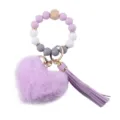 Portachiavi da polso in perle di silicone con cuore di peluche e nappa in pelle PU - Viola