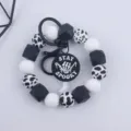 Black and white silicone bead wristlet keychain with Halloween spooky pendant keyring. - Cow Pattern Round Plate Style / White