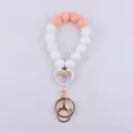 Silikon Perlen Armband Schlüsselanhänger mit Herz Anhänger und goldenem Karabiner. - Lehren ist Herzenssache (Pfirsich) / Knallpink