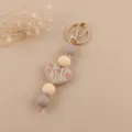 Detailed view of the cute silicone beaded keychain with a heart pendant and rhinestones. - Khaki