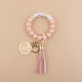 Portachiavi con braccialetto di perle in silicone con nappina e ciondolo mama gift. - Rosa chiaro