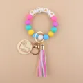Bunte Silikonperlen Armband Schlüsselanhänger mit Mama Holzanhänger und Leder Quaste. - bunt