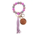 Close-up of silicone beaded wristlet keychain with wooden MAMA pendant and purple PU tassel. - Purple