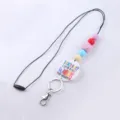 Cordón de cuentas de silicona de colores con colgante temático de profesor y llavero de metal. - Púrpura