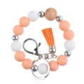 Silicone beaded bracelet keychain wristlet with wood bead and cute PU leather tassel detail. - Rose Pink