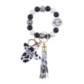 Silicone bead cow print wristlet keychain with cute cow head pendant and long tassel. - Meme
