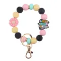 Silicone bead wristlet keychain with cute pencil and flower charms for daily stylish use. - Wristband