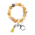 Niedlicher Cartoon Bär Silikon Perlen Schlüsselanhänger Armband mit Holzperle Quaste. - Gelb