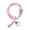 Silikon Perlen Schlüsselanhänger Armband mit süßem Cartoon Bär Anhänger Holzkugel und Quaste. - Rosa