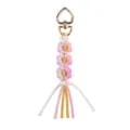 Portachiavi fiore in macramè fatto a mano con chiusura a cuore dorato come accessorio borsa. - Fiore Rosa