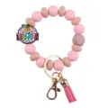 Portachiavi con braccialetto di perline in silicone con ciondolo mela rosa variante. - Polsino