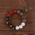 Silicone bead wristlet keychain with floral printed and solid color beads for women keys accessory. - Orange