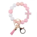 Pink white silicone beaded bracelet keychain with floral cross pendant and cute tassel charm. - Pink