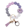 Silicone bead wristlet keychain with purple gradient beads, checkerboard daisy smiley charm. - Purple