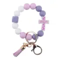 Silicone beaded keychain with purple cross pendant and tassel, stylish bracelet accessory. - Purple
