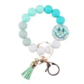 Gradient silicone bead keychain bracelet with smiley daisy pendant and tassel accessory. - Green