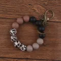 Silicone bead wristlet keychain with leopard print and solid black beads, stylish keyring accessory. - Black