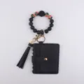 Black silicone beaded wristlet keychain featuring cardholder wallet and stylish tassel charm. - Black