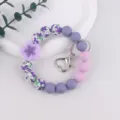 Silicone beaded keychain bracelet with cute flower charm, aesthetic lavender key ring accessories. - Purple
