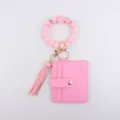 Pink silicone beaded keyring bracelet featuring a matching card holder wallet and tassel. - Pink