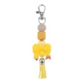 Silicone bead keychain with cute bow pencil charm and PU tassel for stylish bag accessory. - Yellow