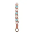 Handmade braided cotton rope keychain with cute dog paw pattern and gold metal ring. - Blue