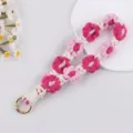 Portachiavi fiore all uncinetto fatto a mano cinturino macramè grazioso cordino per telefono - Rosso rosa