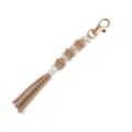 Handmade macrame dog paw keychain lanyard in beige and white cotton with gold clasp. - Brown