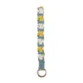 Handmade macrame woven keychain featuring cute floral and paw pattern with solid gold ring. - Lake Blue