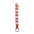 Handmade woven cotton rope keychain strap with cute pink and white floral pattern and metal ring. - Orange