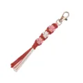 Handmade woven cotton keychain with gold clasp, cute paw pattern and tassel pendant for bags. - Orange