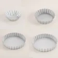 Silver fluted metal tart pan and mini egg tart baking mold for household oven use. - Silver Egg Tart Mold 4-Piece Set