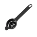 Black plastic egg white separator tool with long handle, essential kitchen baking gadget. - Black