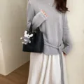 Black leather bucket bag with cute plush rabbit charm, stylish daily shoulder handbag for women. - Black With Pendant