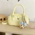 Yellow leather bowling bag with cute plush bear charm, stylish casual shoulder bag. - With Charm / Yellow