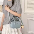 Light blue bowling shoulder bag, stylish commuter handbag with strap and cute bear charm. - With Charm / Blue