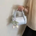 Stylish light blue cylindrical handbag for women, chic pearl tulip charm crossbody bag. - Blue With Charm