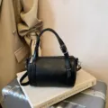 Black minimalist pillow bag, stylish cylinder crossbody shoulder bag for women, trendy chic design. - Black without Pendant