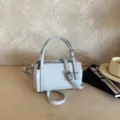 Minimalist cylindrical pillow bag for women, trendy chic crossbody and shoulder bag. - Blue Pendants