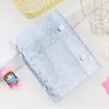 Classeur à anneaux A7 transparent avec motif d'étoiles holographiques et doubles boutons. - Blanc
