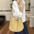 Women's yellow woven leather shoulder bucket bag, stylish hollow crossbody bag for summer. - Yellow