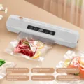 Portable wireless vacuum sealer machine for home use with cutting knife and digital display. - Charging Model with 10 Vacuum Bags / White