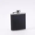 Black leather wrapped stainless steel hip flask with white stitching detail for outdoor use. - 3 oz / 90 ml / Black