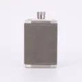 Stainless steel hip flask detail view, grey leather wrap and clean stitching finish. - Gray